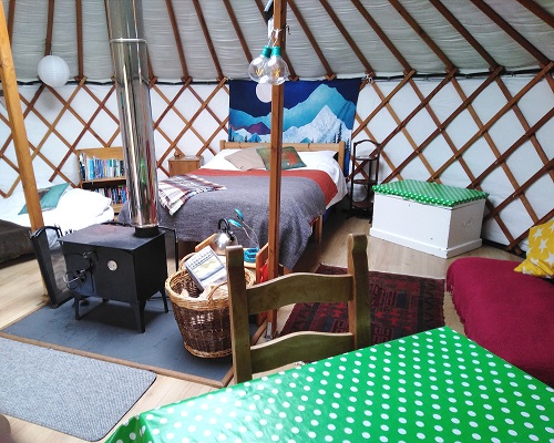 there is ample dining space within the yurt