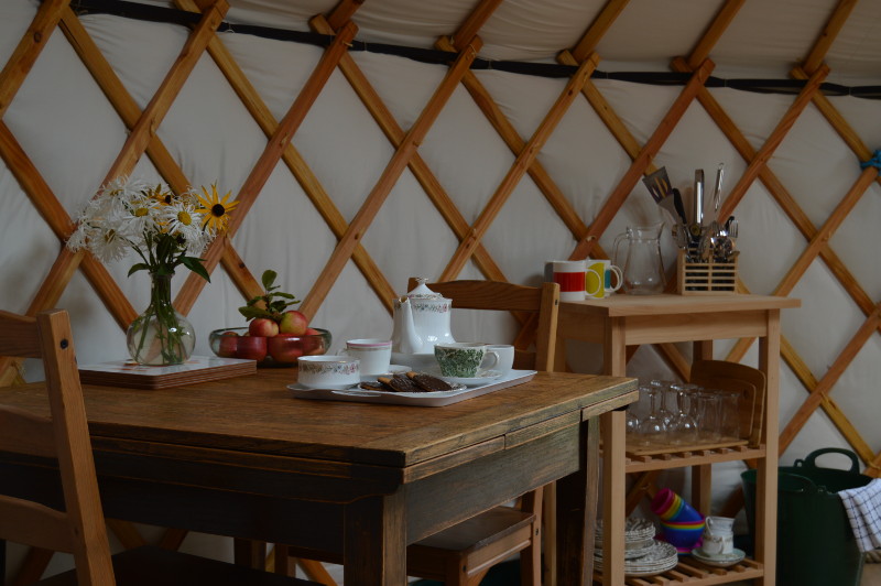 there is ample dining space within the yurt